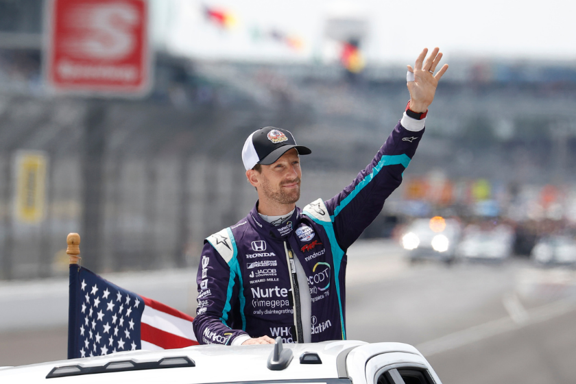 Romain Grosjean waves to the fans during driver introductions before the Big Machine Spiked Coolers Grand Prix on August 14, 2021 on the Indianapolis Motor Speedway Road Course in Indianapolis, Indiana