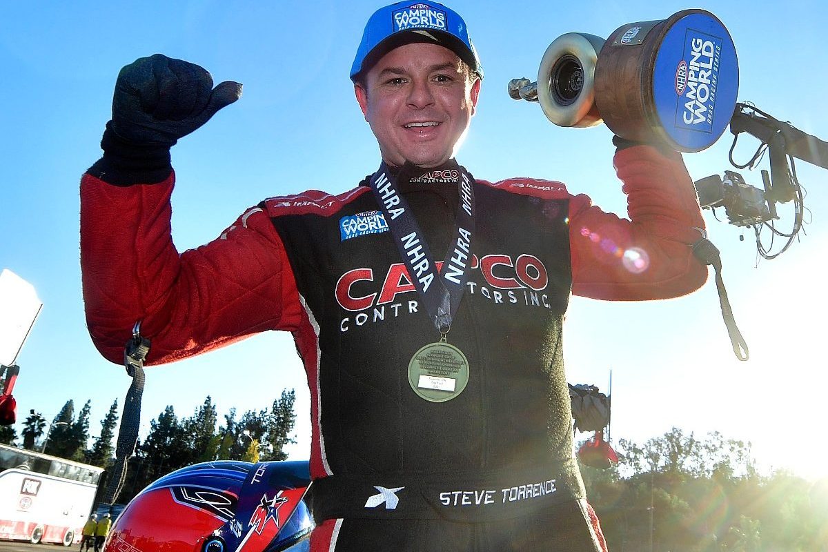 Top Fuel driver Steve Torrence celebrates after winning the event title at the season ending 56th annual NHRA Finals at Pomona Raceway Sunday, Nov. 14, 2021. Earlier Torrence won his fourth consecutive season championship