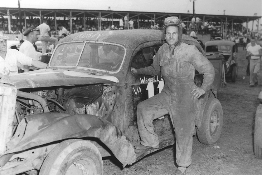 black and white photo of wendell scott on race car