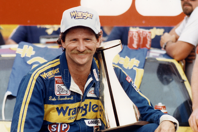 dale earnhardt with trophy at charlotte motor speedway