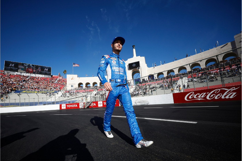 kyle larson walks on track during driver intros at 2022 busch light clash