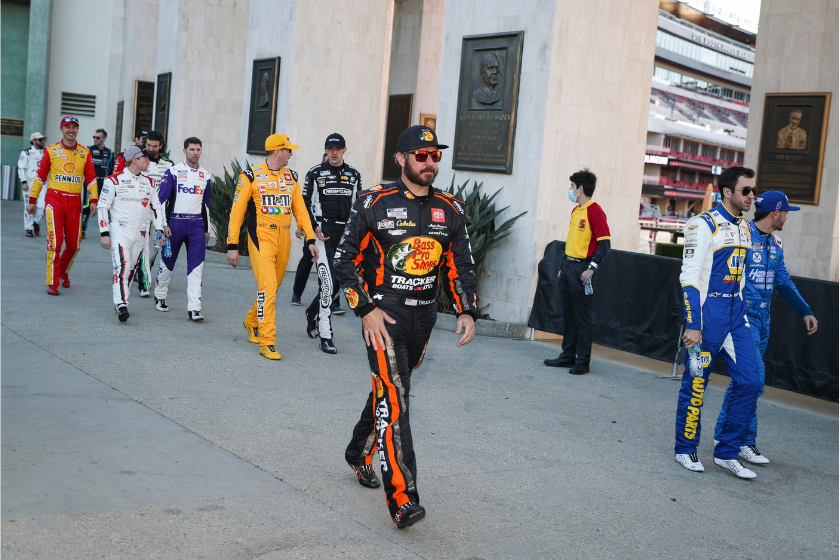martin truex jr in sunglasses walking with other nascar drivers